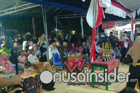 Foto. Tampak Kades Laden Bersama DPRD Fraksi Demokrat Kabupaten Pamekasan sedang duduk santai menikmati musik Uldaul Peserta