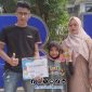 Foto. Arsila Siswi MI Al-Mas'ud Legung Timur saat didampingi Orang Tuanya dan Pengasuh Yayasan Al-mas'ud Desa Legung Timur mengikuti Grand Final Festival Anak Berprestasi ke-14 (FABI-14) dalam kategori lomba Matematika. 