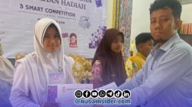 Foto. Az Syahra Nastiti Ramadhani, siswi kelas 1 SMP Integral Luqman Al-Hakim Sumenep saat menerima prestasi di pamekasan